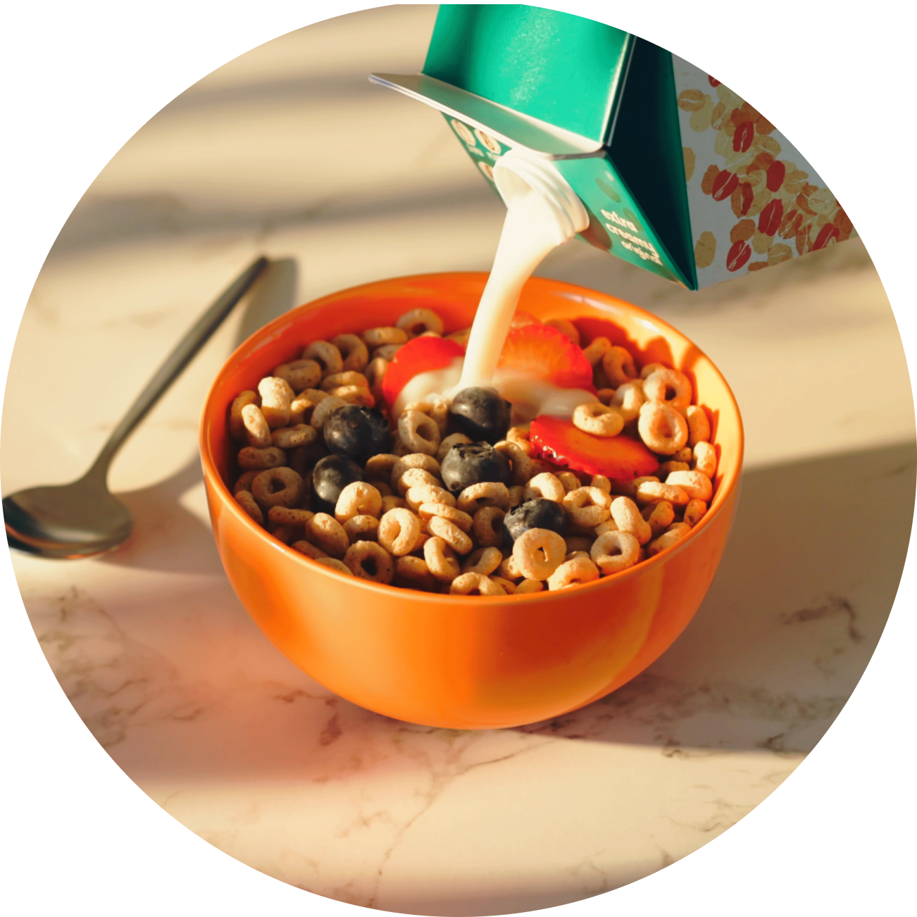 Planet Oat Extra Creamy Oatmilk with a bowl of cereal and fruit