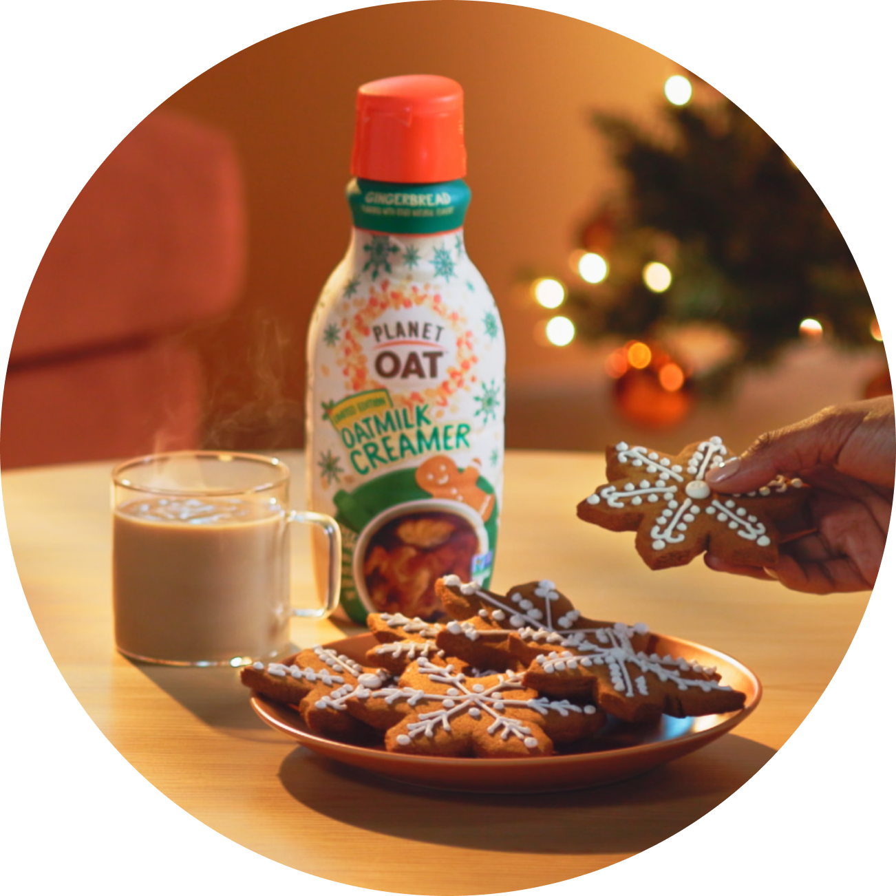 Planet Oat Gingerbread Oatmilk Creamer with a hot coffee, gingerbread cookies in a holiday setting